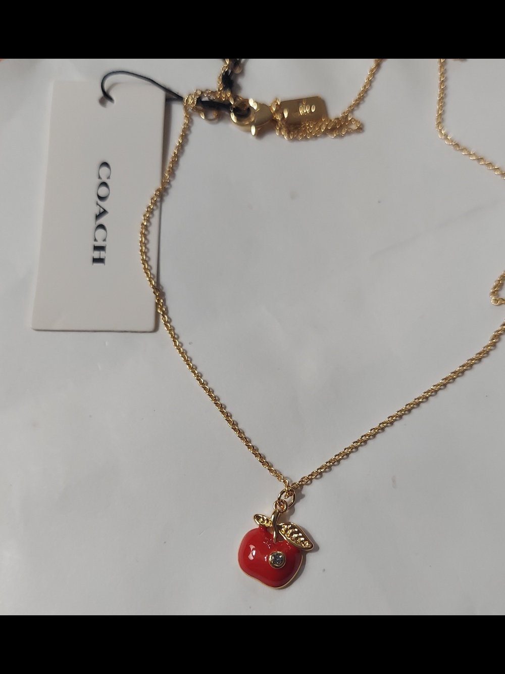 Coach Gold-Tone Necklace with Red Apple Pendant